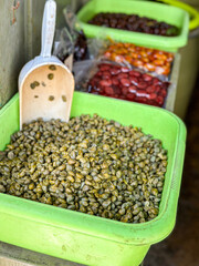 A tub of Greek capers in a shop on Chora the main town of the island of Naxos