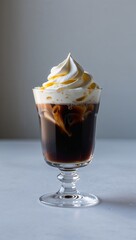 dark iced coffee, topped with a generous dollop of Mango whipped cream