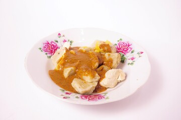 a siomay with fish balls, potatoes, peanut sausage, and tofu on a white background isolated
