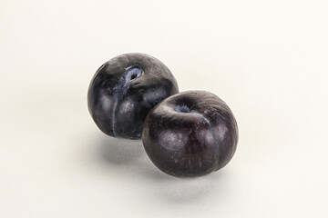 Two ripe sweet black plums