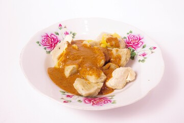 a siomay with fish balls, potatoes, peanut sausage, and tofu on a white background isolated