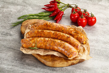 Raw sausages with spices and herbs