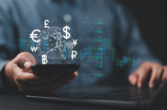 Online banking interbank payment concept. Businessman use smartphone with virtual global currency symbols for money transfers and currency exchanges between countries of the world. - Powered by Adobe