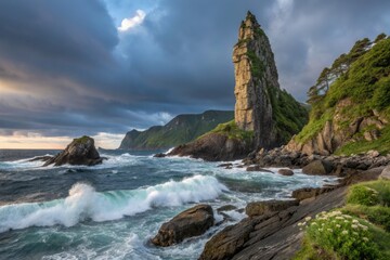 Obraz premium Breathtaking Coastal Landscape Featuring Unique Sea Stack Against Vibrant Sky and Ocean Waves