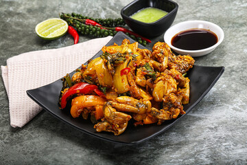 Vietnamese cuisine - fried frog with vegetables