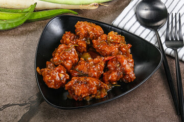 Manchurian chicken with sauce and spices