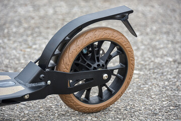The rear wheel of the scooter has a disc and foot brake.