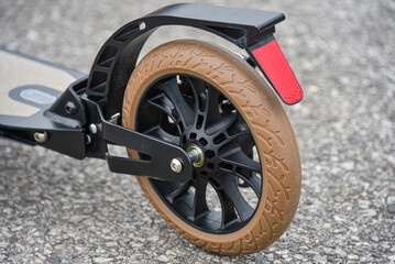 The rear wheel of the scooter has a disc and foot brake.