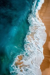 Serene Aerial View of Turquoise Ocean Waves Gently Lapping on Sandy Beach, Capturing Natures Beauty and Tranquility by the Shoreline.