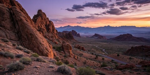 Vast Rocky Desert Landscape Unfolding at Dusk with Jagged Reddish-Brown Mountains and Sky