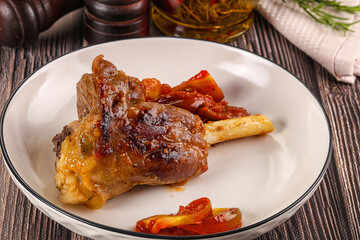 Baked lamb shank with vegetables