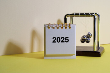 2025 desk calendar newton pendulum tangled
