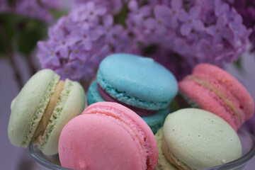 Close-up of colorful macarons with lilac background