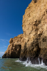 Steep Ocean Rock At Algarve Coast In Portugal