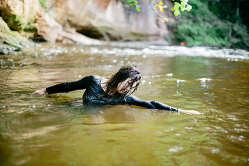 Fototapeta premium Graceful Movement in a Tranquil River Landscape