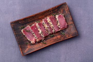 Sliced tuna steak with sesame photography . Top view