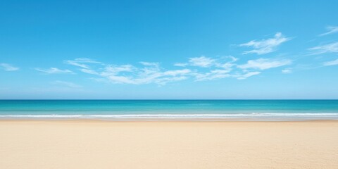 Fototapeta premium Tranquil beach scene with clear blue sky and calm ocean waves, white sandy shore.