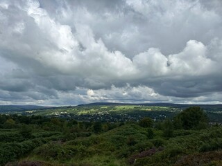 Clouds over the green hills of Yorkshire Dales near Ilkley, Bradford, England, United Kingdom, August 2023