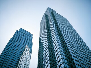 Modern skyscrapers against a blue sky.