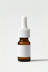 Fototapeta premium Brown glass dropper bottle with a white cap and label, ideal for essential oils or herbal extracts, captured against a clean backdrop