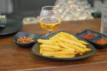 French fries, beer and fried peanuts