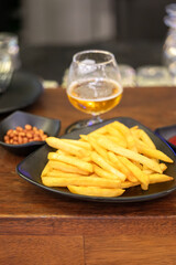 French fries, beer and fried peanuts