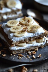 Delicious layered banana and walnut dessert served on a dark plate, showcasing creamy filling and fresh banana slices