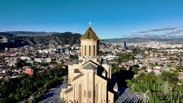 Holy Trinity Cathedral or Tsminda Sameba Church aerial panoramic view in Tbilisi old town. Tbilisi is the capital and the largest city of Georgia