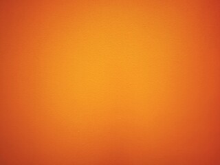 Wall painted in bright and warm orange tone for background and decorations