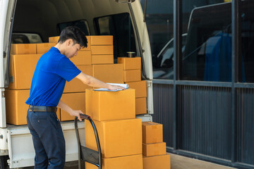 Asian delivery man work in truck for checking the product in the truck, concept ecommerce.