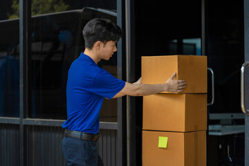 Asian delivery man work in truck for checking the product in the truck, concept ecommerce.