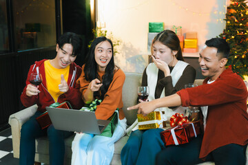 drinks and conversation, social gathering and get together at New Year young people, group and gift exchange at the event, celebration at home.