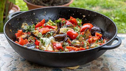 Grilled vegetable salad with zucchini, eggplant, onion, pepper and tomato