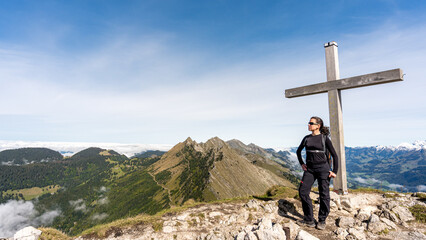 Woman enjoying scenic view atop Dent de Jaman, Swiss Alps