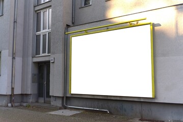 Wide format billboard on a house wall in Berlin.