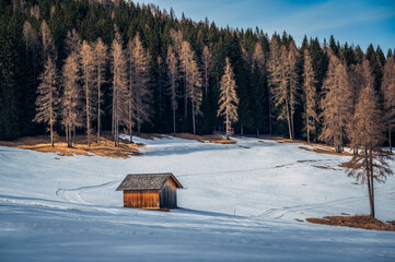 Dolomites in winter. Val Fiscalina, between peaks, larch forests, mountain pines and warm huts.