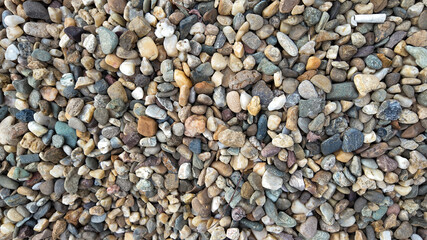 Close-up of a colorful pebble stone arrangement, perfect for concepts related to nature, texture, and landscaping projects
