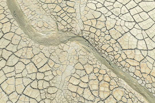 Cracked earth and dried mud texture from above