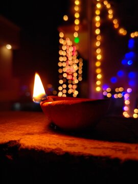 Diya with blur background lights on Celebration
