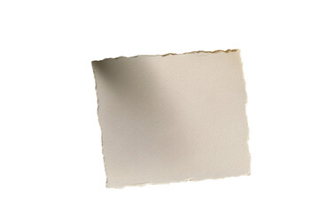 Obraz premium Overhead view of a blank piece of homemade deckle edge paper on a table with mimosa flower, assorted ceramics and linen napkin.