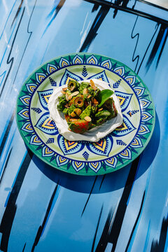 Colorful vegetable salad with feta mousse in Athens
