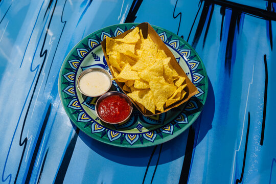 Tortilla nachos with cheese and tomato sauce