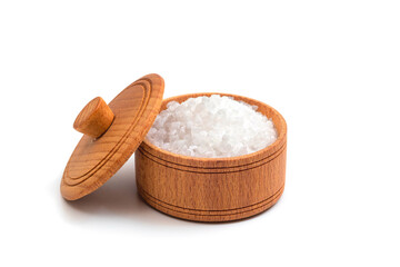 Sea salt in wooden bowl isolated on white background. Clipping path