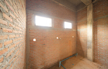 Under construction home or house with scaffolding on site in village. Old unfurnished rental property, living space units. lifestyle. Renovation.