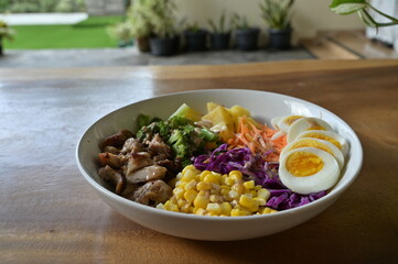 Vegetable salad with various of fresh vegetable, egg, corn in close up view