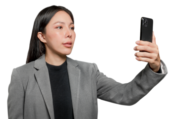 Businesswoman scanning her face to unlock phone security technology