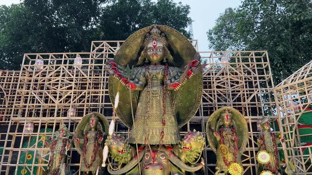 Maa Durga idol in metal look during dusk in procession at Red Road of Kolkata, India.