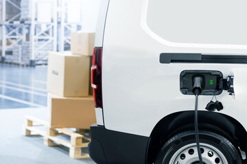 Electric delivery van with connected charging cable © scharfsinn86