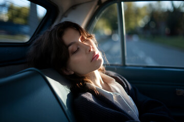 Naklejka premium woman is sleeping in car