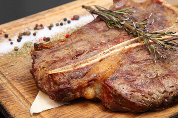 Steak placed on pita bread on a special wooden board. Beef steak on a wooden board.